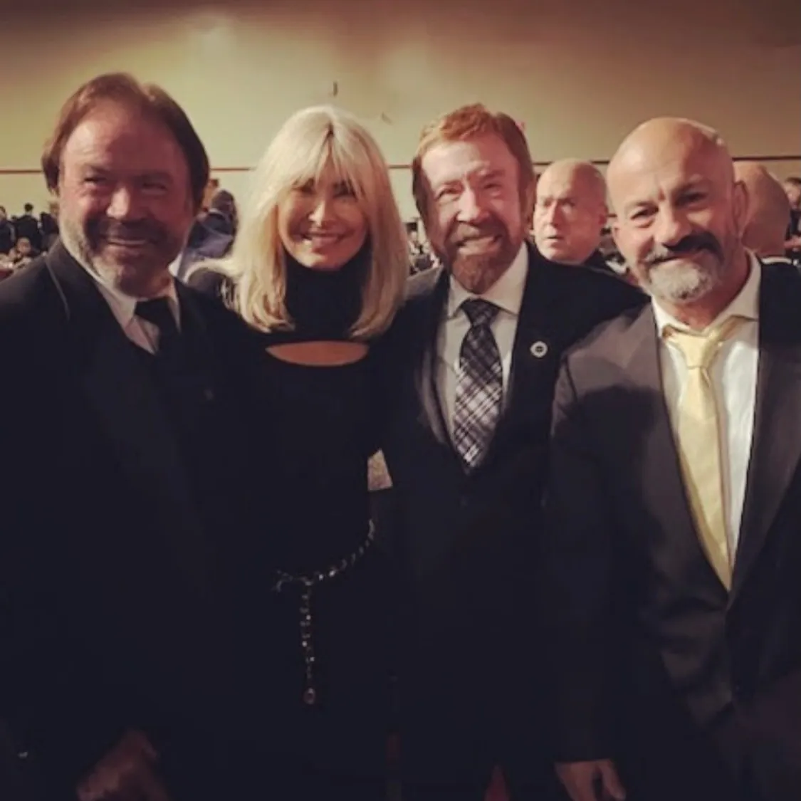 Carlos Machado standing with Chuck Norris